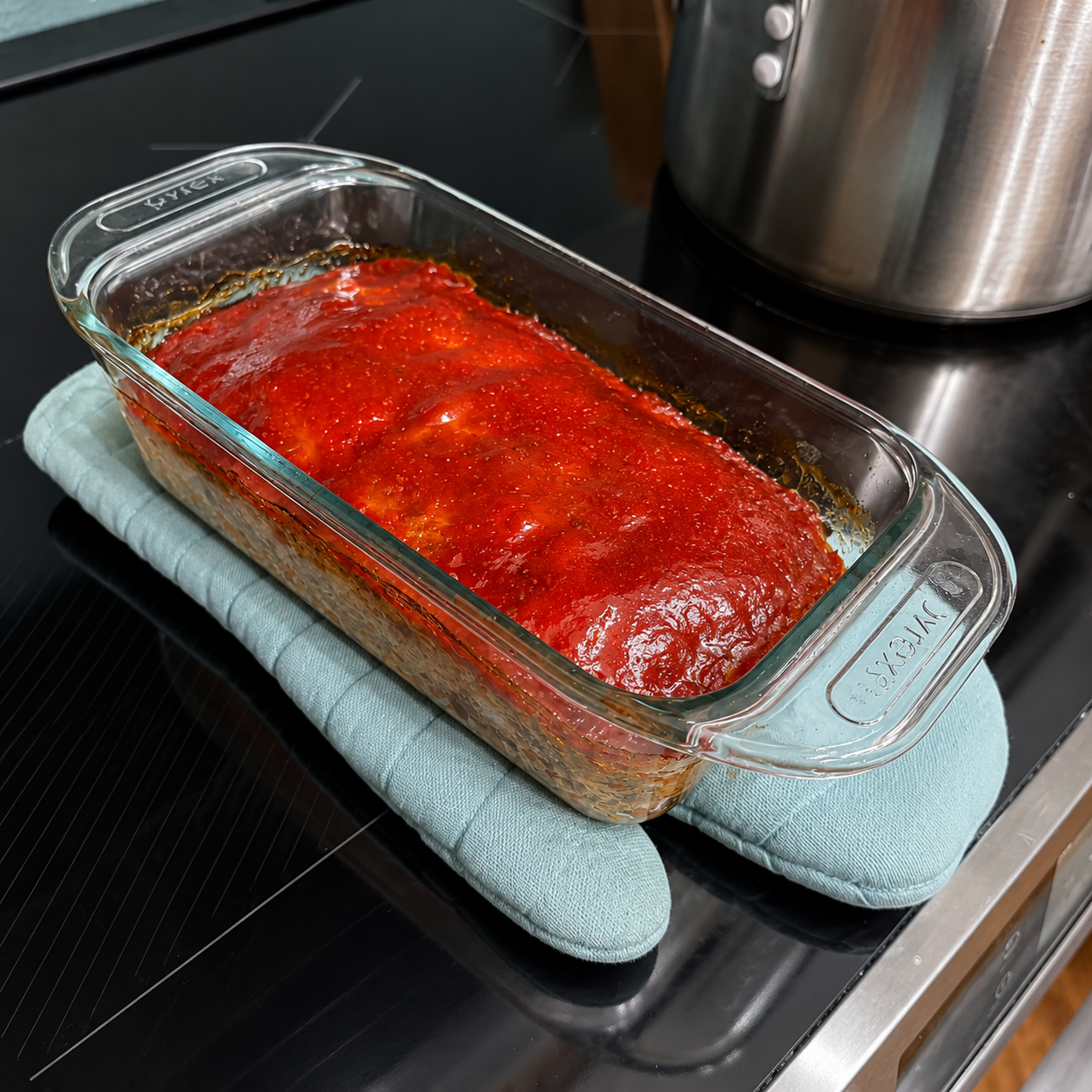 Sliced classic meatloaf served with its ketchup glaze.